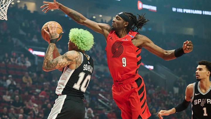 Dec 13, 2024; Portland, Oregon, USA; San Antonio Spurs forward Jeremy Sochan (10) drives to the basket during the first half against Portland Trail Blazers forward Jerami Grant (9) at Moda Center. Mandatory Credit: Troy Wayrynen-Imagn Images Dec 13, 2024; Portland, Oregon, USA; San Antonio Spurs forward Jeremy Sochan (10) drives to the basket during the first half against Portland Trail Blazers forward Jerami Grant (9) at Moda Center. Mandatory Credit: Troy Wayrynen-Imagn Images
