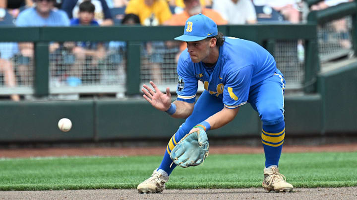 Jun 14, 2025; Omaha, Neb, USA;  UCLA Bruins shortstop Roch Cholowsky (1) fields a ground ball against the Murray State Racers during the ninth inning at Charles Schwab Field. Mandatory Credit: Steven Branscombe-Imagn Images