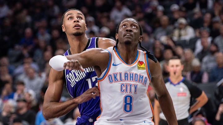 Nov 25, 2024; Sacramento, California, USA; Oklahoma City Thunder forward Jalen Williams (8) and Sacramento Kings forward Keegan Murray (13) fight for position under the basket during the second quarter at Golden 1 Center. Mandatory Credit: Ed Szczepanski-Imagn Images