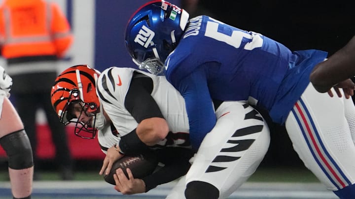 Oct 13, 2024; East Rutherford, New Jersey, USA; New York Giants linebacker Azeez Ojulari (51) tackles Cincinnati Bengals quarterback Joe Burrow (9) during the first half at MetLife Stadium. Mandatory Credit: Robert Deutsch-Imagn Images Oct 13, 2024; East Rutherford, New Jersey, USA; New York Giants linebacker Azeez Ojulari (51) tackles Cincinnati Bengals quarterback Joe Burrow (9) during the first half at MetLife Stadium. Mandatory Credit: Robert Deutsch-Imagn Images