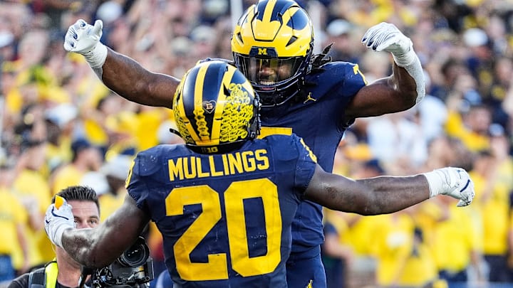 running back Kalel Mullings (20) celebrates a touchdown against USC with running back Donovan Edwards (7) during the second half at Michigan Stadium in Ann Arbor on Saturday, Sept. 21, 2024.