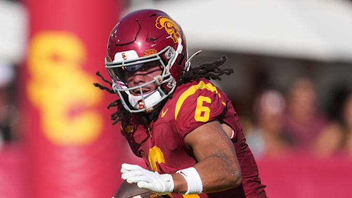 Aug 30, 2025; Los Angeles, California, USA; Southern California Trojans wide receiver Makai Lemon (6) carries the ball against the Missouri State Bears in the first half at United Airlines Field at Los Angeles Memorial Coliseum. Mandatory Credit: Kirby Lee-Imagn Images