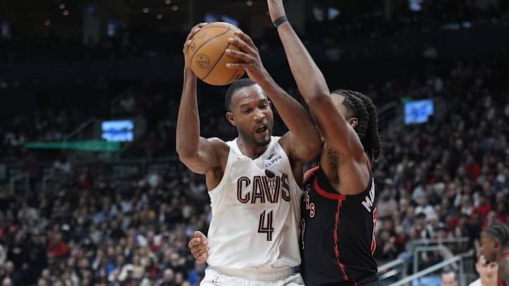 Apr 23, 2026; Toronto, Ontario, CAN; Cleveland Cavaliers forward Evan Mobley (4) battles with Toronto Raptors forward Collin Murray-Boyles (12) during the second half of game three of the first round of the 2026 NBA Playoffs at Scotiabank Arena. Mandatory Credit: John E. Sokolowski-Imagn Images