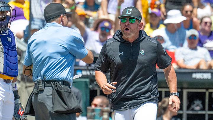 Jun 22, 2025; Omaha, Neb, USA;  Coastal Carolina Chanticleers head coach Kevin Schnall (9) gets thrown out of the game arguing with the umpires during the game against the LSU Tigers during the first inning at Charles Schwab Field. Mandatory Credit: Steven Branscombe-Imagn Images