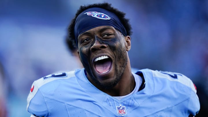 Tennessee Titans linebacker Arden Key (49) celebrates on the sidelines during the fourth quarter against the Kansas City Chiefs at Nissan Stadium in Nashville, Tenn., Sunday, Dec. 21, 2025.