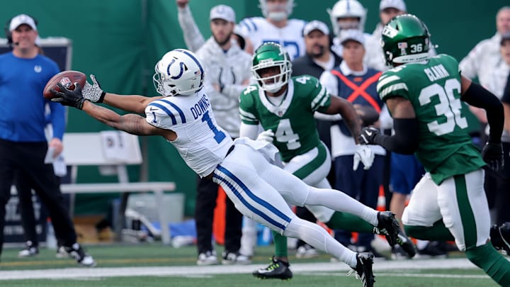 Nov 17, 2024; East Rutherford, New Jersey, USA; Indianapolis Colts wide receiver Josh Downs (1) catches a pass against New York Jets cornerback D.J. Reed (4) and safety Chuck Clark (36) during the first quarter at MetLife Stadium. Mandatory Credit: Brad Penner-Imagn Images Nov 17, 2024; East Rutherford, New Jersey, USA; Indianapolis Colts wide receiver Josh Downs (1) catches a pass against New York Jets cornerback D.J. Reed (4) and safety Chuck Clark (36) during the first quarter at MetLife Stadium. Mandatory Credit: Brad Penner-Imagn Images