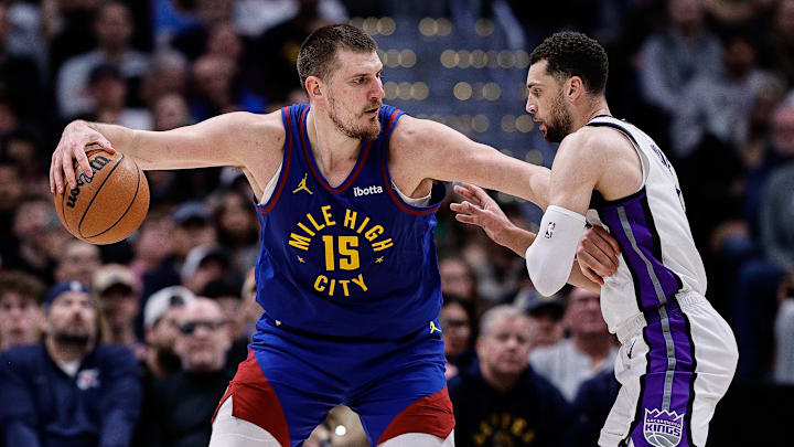 Denver Nuggets center Nikola Jokic (15) controls the ball as Sacramento Kings guard Zach LaVine (8) guards in the fourth quarter at Ball Arena. Mandatory Credit: Isaiah J. Downing-Imagn Images