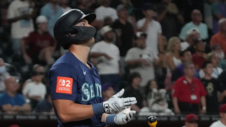 Seattle Mariners player Dominic Canzone hits a two run home run against the Arizona Diamondbacks in the ninth inning at Chase Field in 2025. Seattle Mariners player Dominic Canzone hits a two run home run against the Arizona Diamondbacks in the ninth inning at Chase Field in 2025.