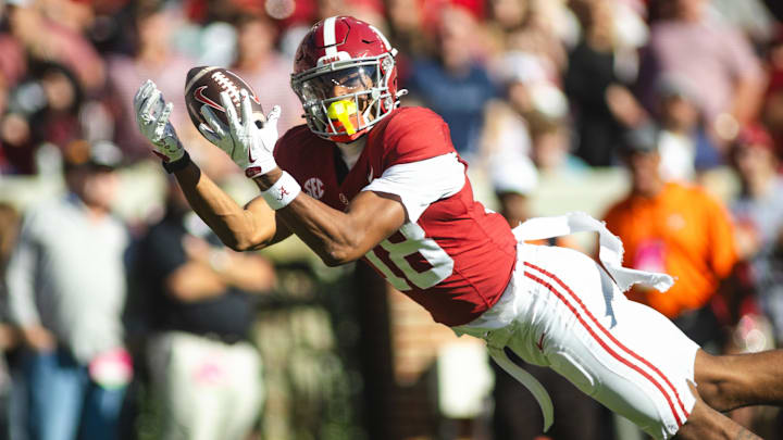 Nov 16, 2024; Tuscaloosa, Alabama, USA; Alabama Crimson Tide wide receiver Caleb Odom (18) dives in an attempt to complete a pass agains the Mercer Bears during the first quarter at Bryant-Denny Stadium. Mandatory Credit: Will McLelland-Imagn Images