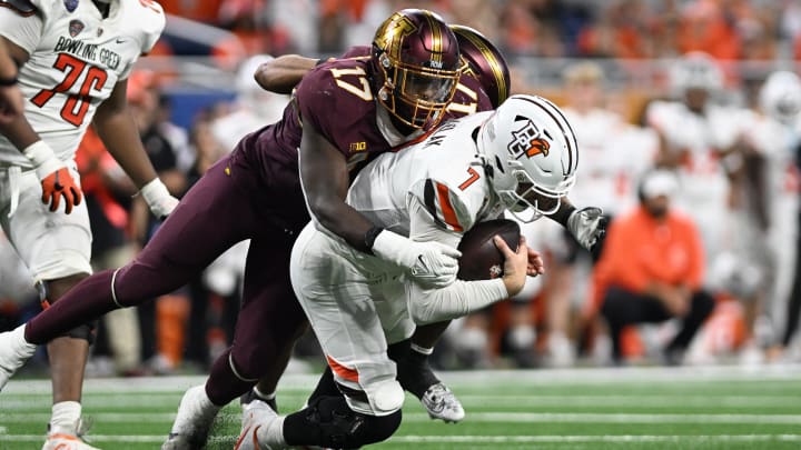 Dec 26, 2023; Detroit, MI, USA; Minnesota Golden Gophers defensive lineman Jah Joyner (17) and defensive back Tre'Von Jones (2) sack Bowling Green Falcons quarterback Connor Bazelak (7) in the third quarter at Ford Field. Mandatory Credit: Lon Horwedel-USA TODAY Sports Dec 26, 2023; Detroit, MI, USA; Minnesota Golden Gophers defensive lineman Jah Joyner (17) and defensive back Tre'Von Jones (2) sack Bowling Green Falcons quarterback Connor Bazelak (7) in the third quarter at Ford Field. Mandatory Credit: Lon Horwedel-USA TODAY Sports
