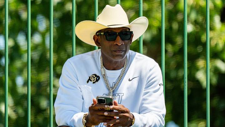 Deion Sanders takes in the second day of Cleveland Browns training camp, July 30, 2026, in Berea, Ohio. Deion Sanders takes in the second day of Cleveland Browns training camp, July 30, 2026, in Berea, Ohio.