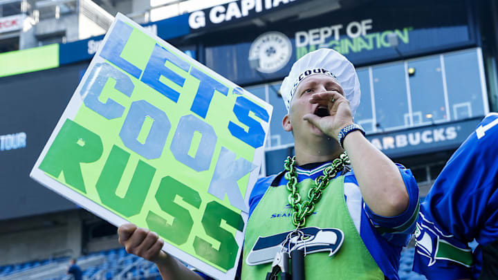 Sep 12, 2022; Seattle, Washington, USA; A Seattle Seahawks fan cheers against Denver Broncos quarterback Russell Wilson (not pictured) during pregame warmups at Lumen Field. Mandatory Credit: Joe Nicholson-Imagn Images