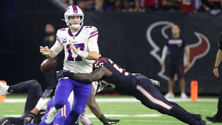 Bills quarterback Josh Allen has the ball stripped by Texans linebacker Whitney Mercilus. The