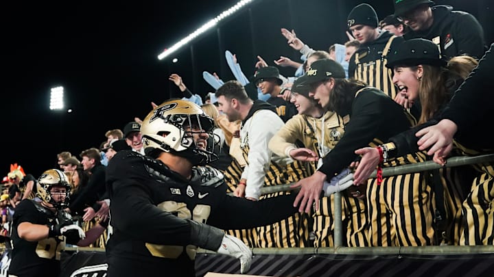 Purdue Boilermakers defensive lineman Isaiah Nichols (93) celebrates with fans 