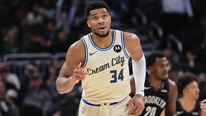Nov 29, 2025; Milwaukee, Wisconsin, USA; Milwaukee Bucks forward Giannis Antetokounmpo (34) reacts after scoring his 21,000th career point in the third quarter against the Brooklyn Nets at Fiserv Forum. Mandatory Credit: Benny Sieu-Imagn Images