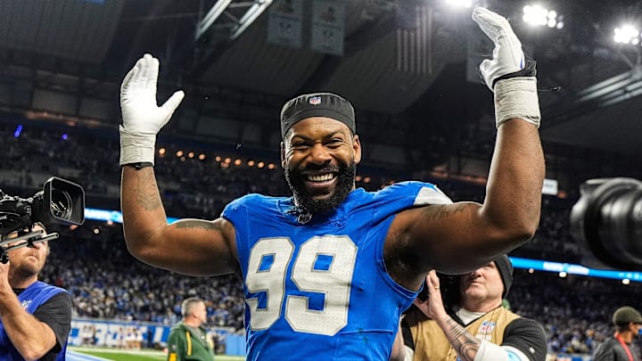 Detroit Lions defensive end Za'Darius Smith (99) celebrates 34-31 win over Green Bay Packers as he exits the field at Ford Field in Detroit on Thursday, Dec. 5, 2024.