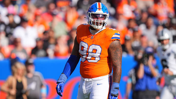 Oct 6, 2024; Denver, Colorado, USA; Denver Broncos defensive end John Franklin-Myers (98) reacts to a defensive stop in the second half against the Las Vegas Raiders at Empower Field at Mile High. Mandatory Credit: Ron Chenoy-Imagn Images Oct 6, 2024; Denver, Colorado, USA; Denver Broncos defensive end John Franklin-Myers (98) reacts to a defensive stop in the second half against the Las Vegas Raiders at Empower Field at Mile High. Mandatory Credit: Ron Chenoy-Imagn Images
