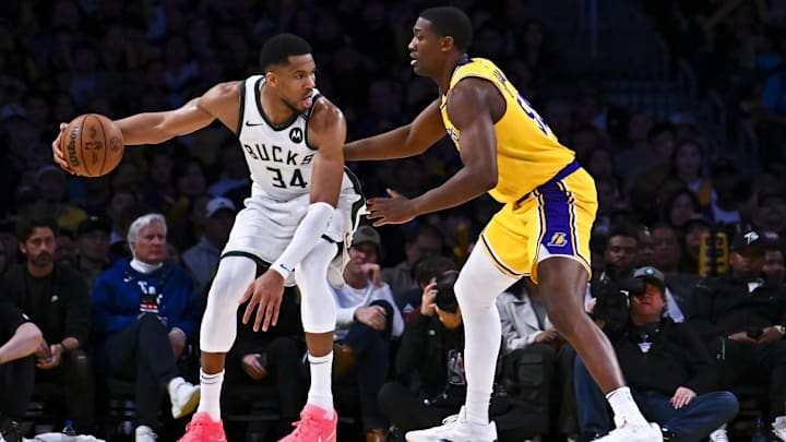Mar 20, 2025; Los Angeles, California, USA; Los Angeles Lakers center Trey Jemison III (55) defends against Milwaukee Bucks forward Giannis Antetokounmpo (34) during the second half at Crypto.com Arena. Mandatory Credit: Jonathan Hui-Imagn Images