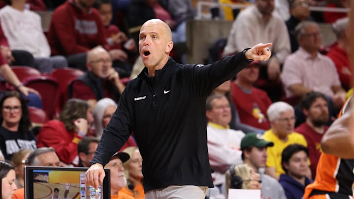 Jan 10, 2026; Ames, Iowa, USA; Oklahoma State Cowboys head coach Steve Lutz watches his team play the Iowa State Cyclones during the second half at James H. Hilton Coliseum. Mandatory Credit: Reese Strickland-Imagn Images