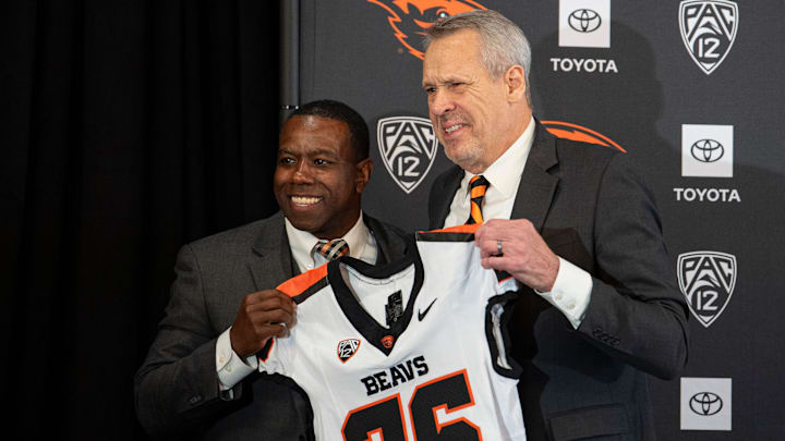 Vice president and director of athletics Scott Barnes, right, introduces JaMarcus Shephard as the new head coach for Oregon State football at Reser Stadium on Tuesday, Dec. 2, 2025, in Corvallis, Ore.
