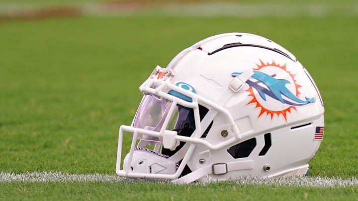Jul 27, 2022; Miami Gardens, FL, USA; A general view of a Miami Dolphins helmet on the field during training camp at Baptist Health Training Complex. Mandatory Credit: Jasen Vinlove-Imagn Images