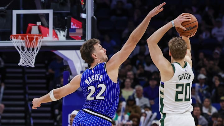 Feb 9, 2026; Orlando, Florida, USA; Orlando Magic forward Franz Wagner (22) defends Milwaukee Bucks guard AJ Green (20) during the second half at Kia Center. Mandatory Credit: Mike Watters-Imagn Images