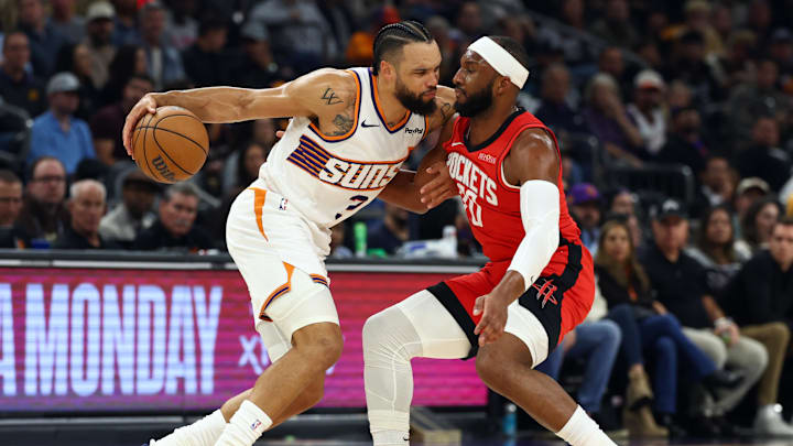 Nov 24, 2025; Phoenix, Arizona, USA; Phoenix Suns forward Dillon Brooks (3) controls the ball against Houston Rockets guard Josh Okogie (20) in the first half at Mortgage Matchup Center. Mandatory Credit: Mark J. Rebilas-Imagn Images