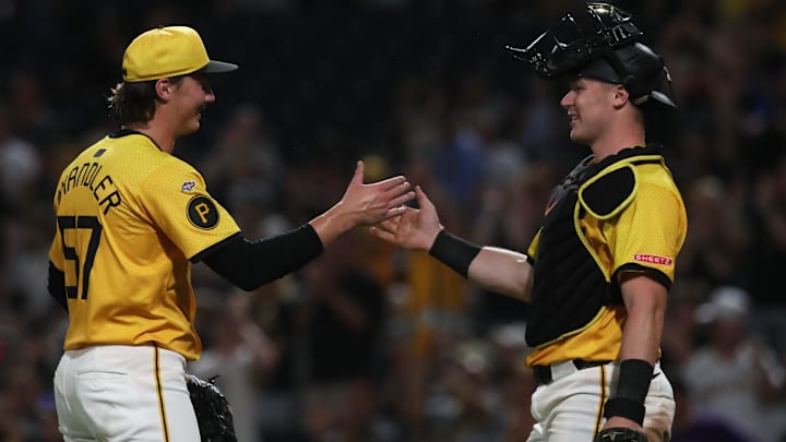 Aug 22, 2025; Pittsburgh, Pennsylvania, USA; Pittsburgh Pirates relief pitcher Bubba Chandler (57) celebrates with catcher Henry Davis (32) after the game against the Colorado Rockies at PNC Park. Mandatory Credit: Charles LeClaire-Imagn Images