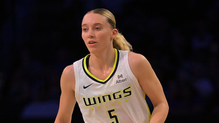 Sep 7, 2025; Los Angeles, California, USA;  Dallas Wings guard Paige Bueckers (5) handles the ball during the first half against the Los Angeles Sparks at Crypto.com Arena. Mandatory Credit: Jayne Kamin-Oncea-Imagn Images