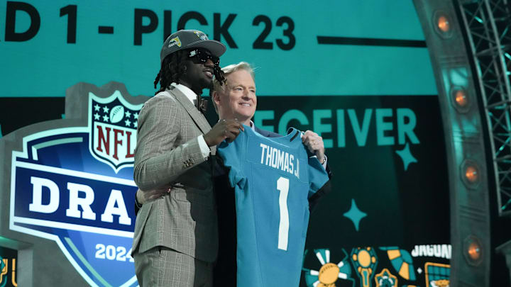 Apr 25, 2024; Detroit, MI, USA; LSU Tigers wide receiver Brian Thomas Jr. poses with NFL commissioner Roger Goodell after being selected by the Jacksonville Jaguars as the No. 23 pick during the first round of the 2024 NFL Draft.