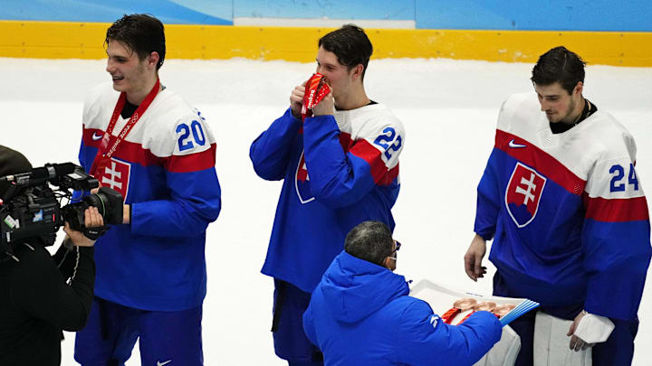 Feb 19, 2022; Beijing, China; Team Slovakia defender Samuel Knazko (22) celebrates winning the bronze medal men s ice hockey game against Sweden during the Beijing 2022 Olympic Winter Games at National Indoor Stadium. Slovakia won the game 4-0. Mandatory Credit: George Walker IV-Imagn Images
