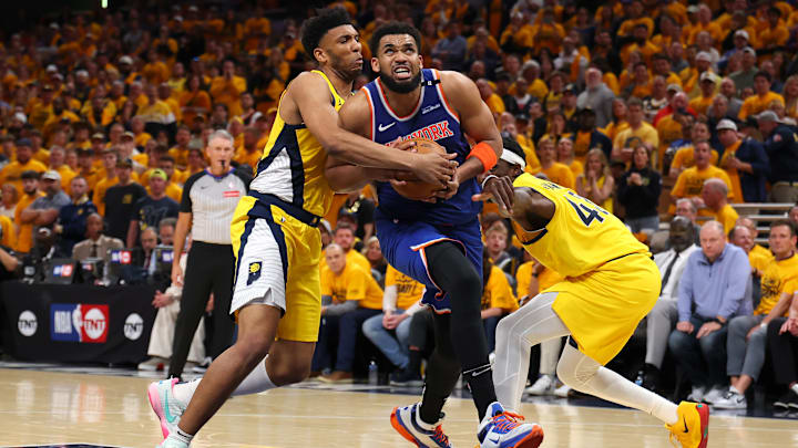 Tony Bradley ties up Karl-Anthony Towns in New York Knicks v Indiana Pacers - Game 3
