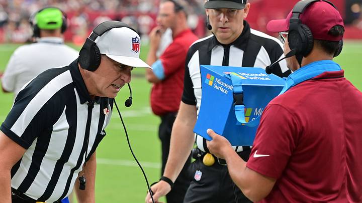 NFL referee John Hussey watches a replay during the first half of the game between the Arizona Cardinals and Los Angeles Rams 
