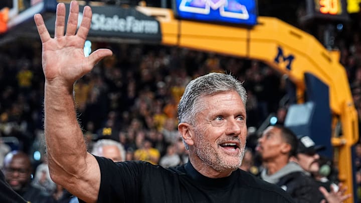 Michigan football head coach Kyle Whittingham waves at the crowd as he is being introduced on the floor during the first half between Michigan and USC at Crisler Center in Ann Arbor on Friday, Jan. 2, 2026.