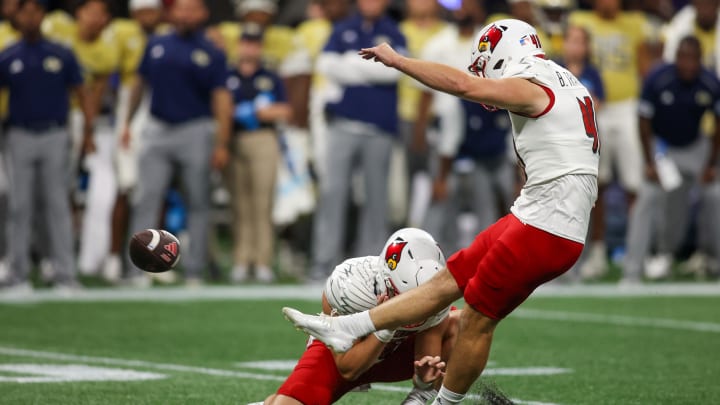 Sep 1, 2023; Atlanta, Georgia, USA; Louisville Cardinals place kicker Brock Travelstead (40) kicks a field goal against the Georgia Tech Yellow Jackets in the fourth quarter at Mercedes-Benz Stadium. Sep 1, 2023; Atlanta, Georgia, USA; Louisville Cardinals place kicker Brock Travelstead (40) kicks a field goal against the Georgia Tech Yellow Jackets in the fourth quarter at Mercedes-Benz Stadium.