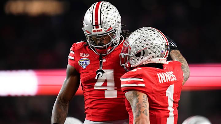 Ohio State Buckeyes wide receiver Brandon Inniss (1) celebrates a touchdown by wide receiver Jeremiah Smith (4) during the Cotton Bowl at AT&T Stadium in Arlington, Texas for the College Football Playoff quarterfinal game against the Miami Hurricanes on Dec. 31, 2025. Ohio State lost 24-14.