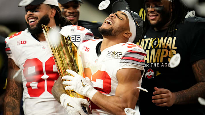 Ohio State Buckeyes running back TreVeyon Henderson (32) celebrates with the trophy following the 34-23 win over the Notre Dame Fighting Irish to win the College Football Playoff National Championship at Mercedes-Benz Stadium in Atlanta on Jan. 22, 2025. Ohio State Buckeyes running back TreVeyon Henderson (32) celebrates with the trophy following the 34-23 win over the Notre Dame Fighting Irish to win the College Football Playoff National Championship at Mercedes-Benz Stadium in Atlanta on Jan. 22, 2025.
