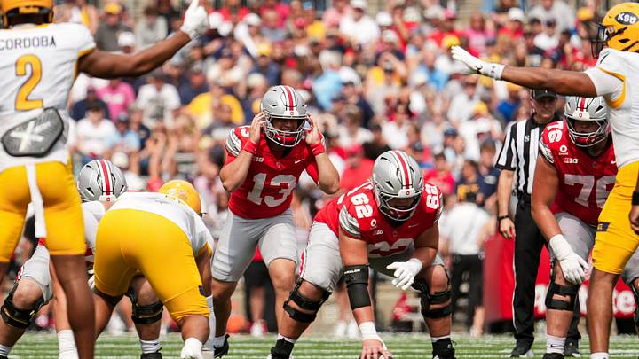 Ohio State Buckeyes quarterback Luke Fahey (13) takes a snap from offensive lineman Joshua Padilla (62) during the NCAA football game against the Kent State Golden Flashes at Ohio Stadium in Columbus on Sept. 19, 2026. Ohio State won 59-3. Ohio State Buckeyes quarterback Luke Fahey (13) takes a snap from offensive lineman Joshua Padilla (62) during the NCAA football game against the Kent State Golden Flashes at Ohio Stadium in Columbus on Sept. 19, 2026. Ohio State won 59-3.