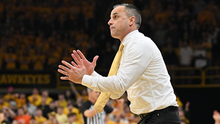 Iowa Hawkeyes head coach Ben McCollum Iowa Hawkeyes head coach Ben McCollum