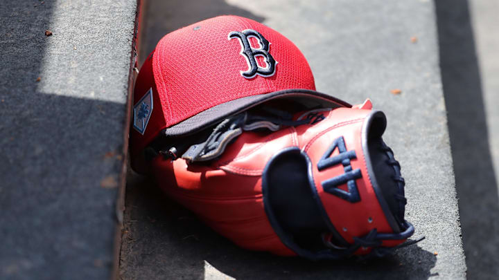 Mar 15, 2019; Tampa, FL, USA; Boston Red Sox hat and glove lay in the dugout  at George M. Steinbrenner Field. Mandatory Credit: Kim Klement-Imagn Images