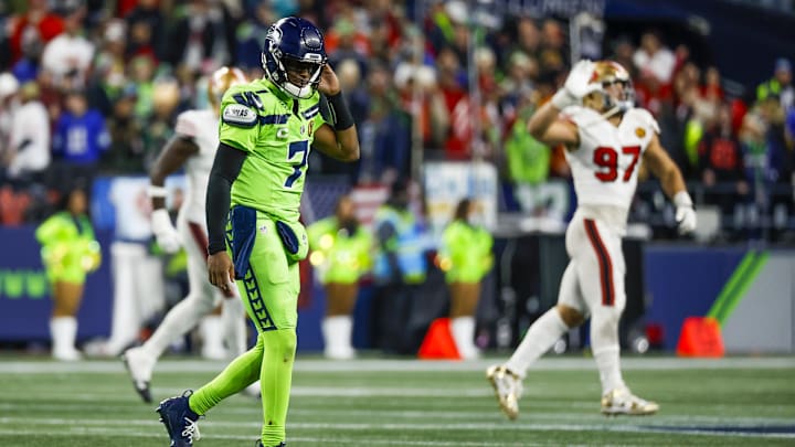 Nov 23, 2023; Seattle, Washington, USA; Seattle Seahawks quarterback Geno Smith (7) reacts following