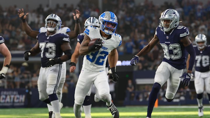 Oct 13, 2024; Arlington, Texas, USA; Detroit Lions safety Brian Branch (32) returns an interception during the second half against the Dallas Cowboys  at AT&T Stadium. Mandatory Credit: Kevin Jairaj-Imagn Images