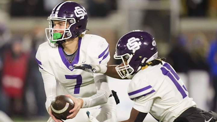 Sevier County's Cooper Newman (7) hands off to Nathan Patterson (15) during the TSSAA Class 5A high school football championship against Page on Friday, Dec. 6, 2024, in Chattanooga, Tenn.