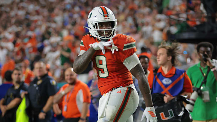 Sep 20, 2025; Miami Gardens, Florida, USA; Miami Hurricanes tight end Elija Lofton (9) reacts after carrying the football against the Florida Gators during the second quarter at Hard Rock Stadium. Mandatory Credit: Sam Navarro-Imagn Images
