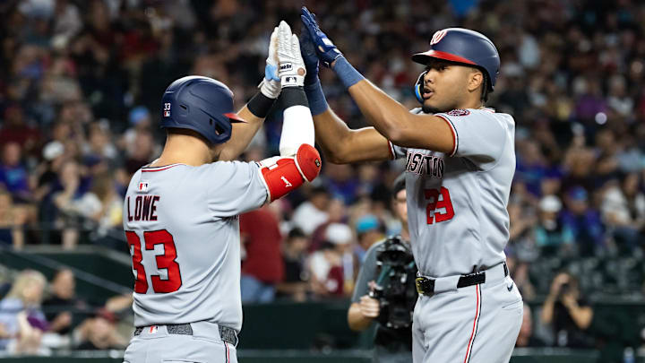 May 30, 2025; Phoenix, Arizona, USA; Washington Nationals outfielder James Wood (right) celebrates with Nathaniel Lowe after hitting a solo home run in the third inning against the Arizona Diamondbacks at Chase Field.