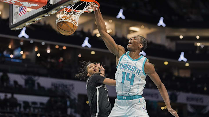 Jan 29, 2025; Charlotte, North Carolina, USA; Charlotte Hornets forward Moussa Diabate (14) with a dunk against Brooklyn Nets forward Ziaire Williams (8) during the second half at Spectrum Center. Mandatory Credit: Jim Dedmon-Imagn Images Jan 29, 2025; Charlotte, North Carolina, USA; Charlotte Hornets forward Moussa Diabate (14) with a dunk against Brooklyn Nets forward Ziaire Williams (8) during the second half at Spectrum Center. Mandatory Credit: Jim Dedmon-Imagn Images