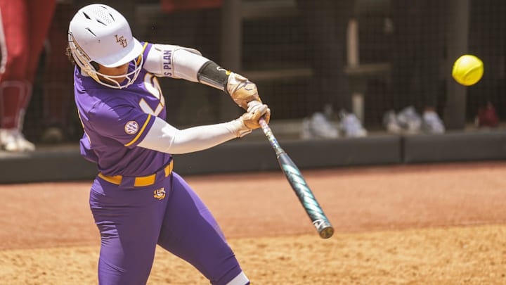 May 8, 2025; Athens, GA, USA; LSU utility Tori Edwards (42) drives in a run with a hit against Oklahoma at Jack Turner Stadium. Mandatory Credit: Dale Zanine-Imagn Images