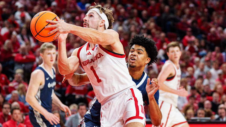 Nebraska Cornhuskers guard Sam Hoiberg shoots the ball against Creighton Bluejays guard Austin Swartz. Nebraska Cornhuskers guard Sam Hoiberg shoots the ball against Creighton Bluejays guard Austin Swartz.