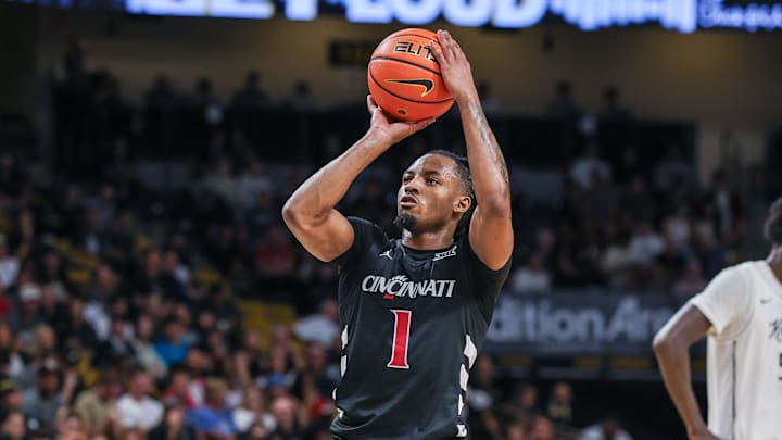 Feb 5, 2025; Orlando, Florida, USA; Cincinnati Bearcats guard Day Day Thomas (1) shoots a free throw during the first half against the UCF Knights at Addition Financial Arena. Mandatory Credit: Mike Watters-Imagn Images