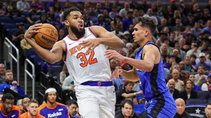 Dec 27, 2024; Orlando, Florida, USA; New York Knicks center Karl-Anthony Towns (32) looks to pass around Orlando Magic forward Tristan da Silva (23) during the first quarter at Kia Center. Mandatory Credit: Mike Watters-Imagn Images Dec 27, 2024; Orlando, Florida, USA; New York Knicks center Karl-Anthony Towns (32) looks to pass around Orlando Magic forward Tristan da Silva (23) during the first quarter at Kia Center. Mandatory Credit: Mike Watters-Imagn Images